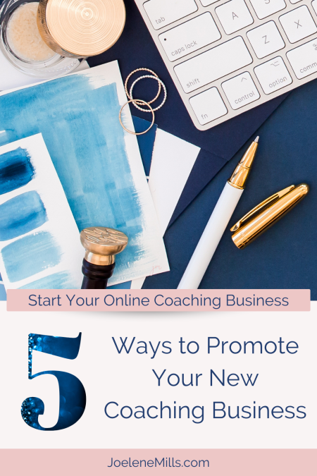  ways to promote your new coaching business wirtten under a photo of a blue desk wit ha keyboard, watercolour cards, and a gold pen