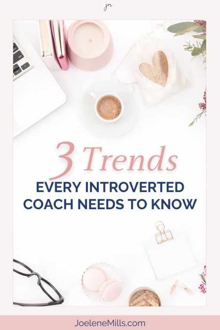 Womans desk with a laptop, coffee and glasses. Pink and gold accessories and the words "2 trends every introverted coach needs to know" 