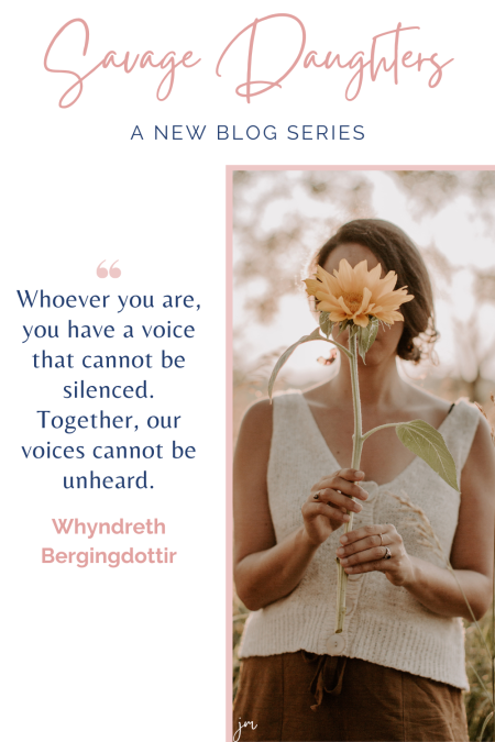 Woman holding a wildflower in front of her face. Savage Daughters article series from Joelene Mills