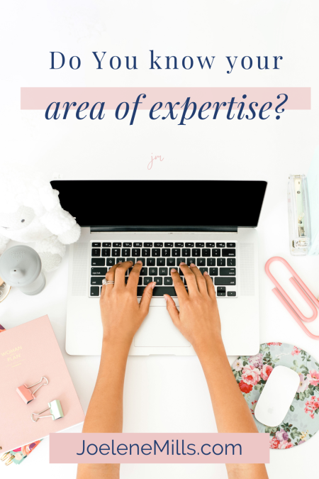 Close up of womans hands working on her laptop on a desk with pink accessories with the wors "Do you know your area of expertise?"
