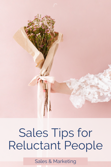 Woman holding a bouquet of flowers with the words Sales tips for reluctant people + Sales and Marketing below