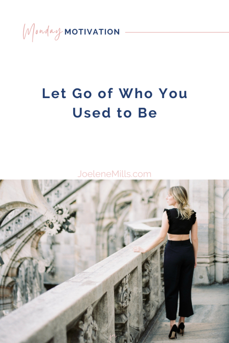 Woman standing on historic balcony looking ahead—symbolizing clarity, reflection, and the choice to live out of your imagination, not your history. With the words Let go of who you used to be