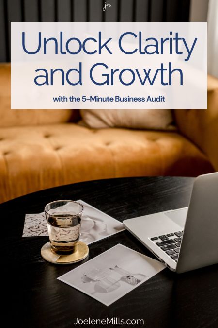 Glass of water and laptop on a table, with the wors unlock clarity and growth with the 5-minute business audit