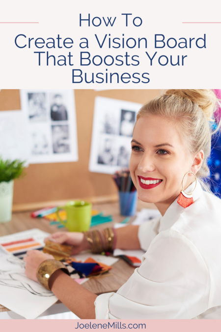 woman creating a vision board at her desk with the words how to create a vision board that boosts your business