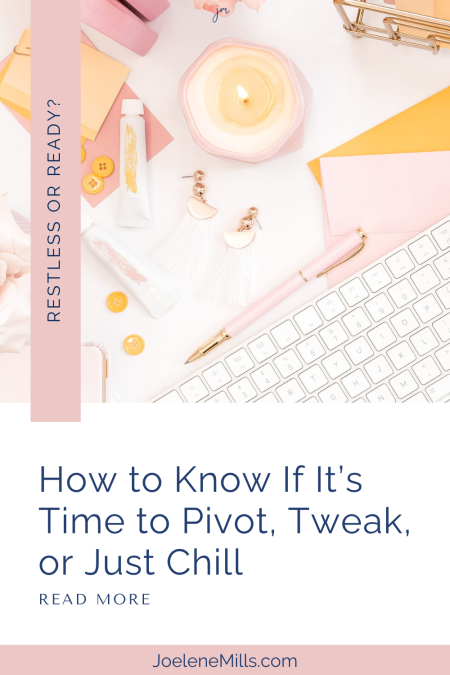 Flat lay of feminine workspace with candle, earrings, and keyboard, promoting blog post for introverted entrepreneurs about pivoting or tweaking a business.