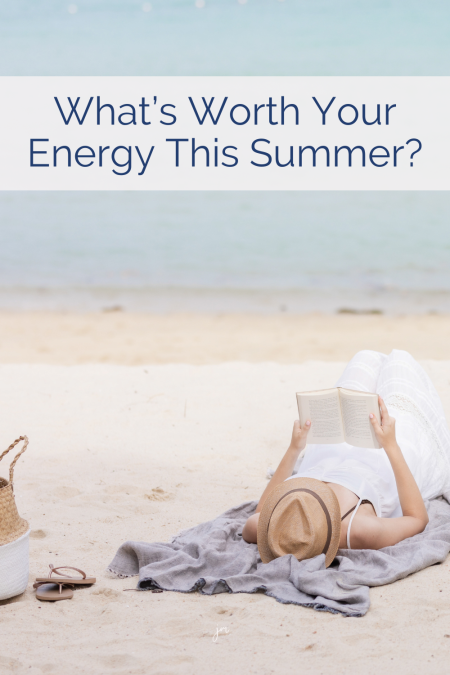 Woman in sunhat reading on the beach with sandals and a tote nearby—evoking calm, quiet marketing, and sustainable summer business energy.